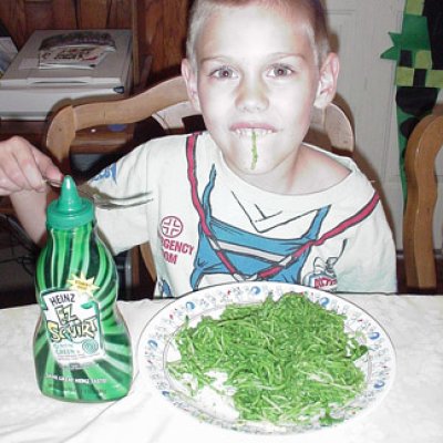 He loves his green spaghetti!
